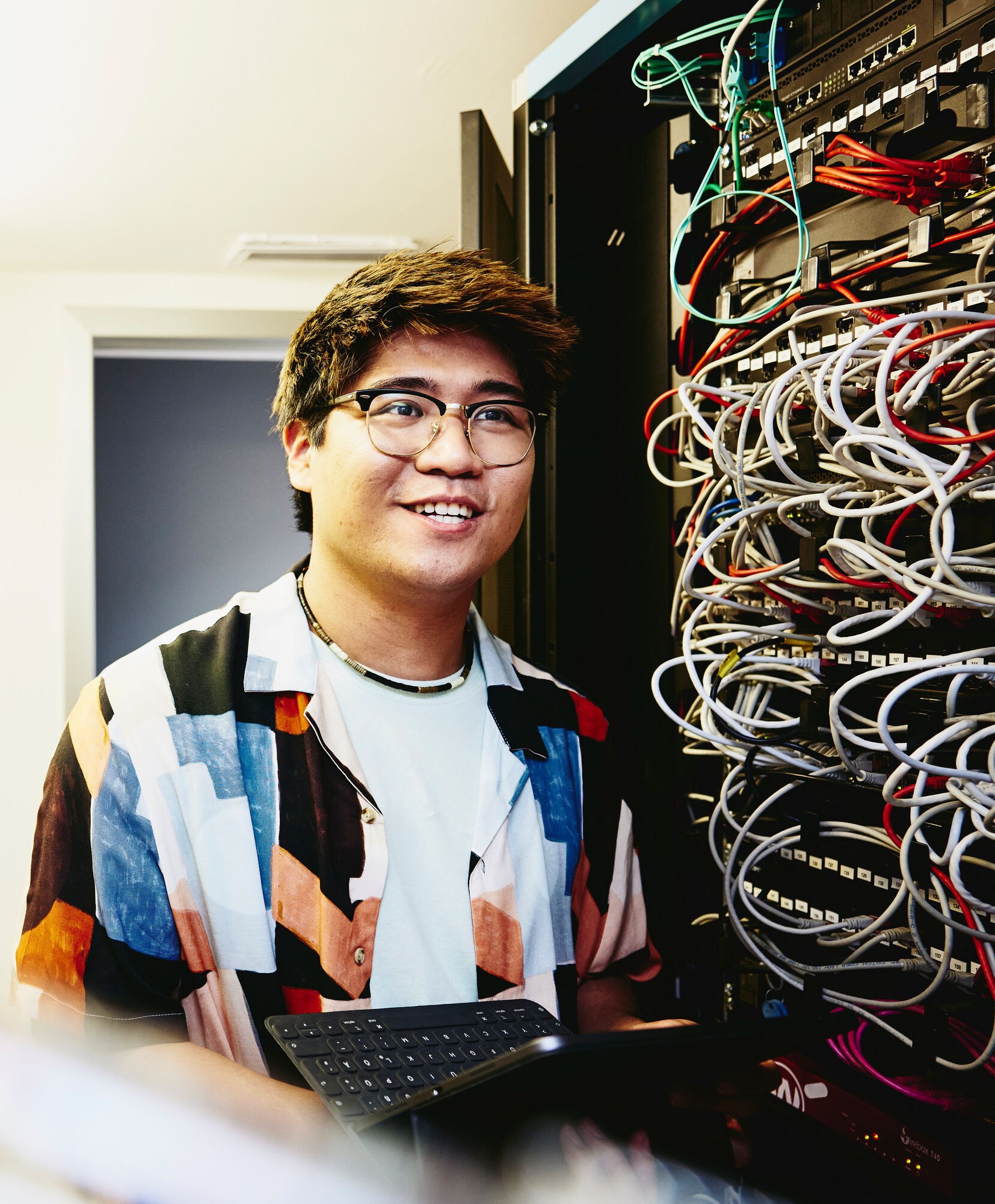man standing in a servers room