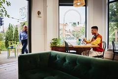 Man on his tablet in a bar