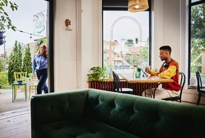 Man on his tablet in a bar