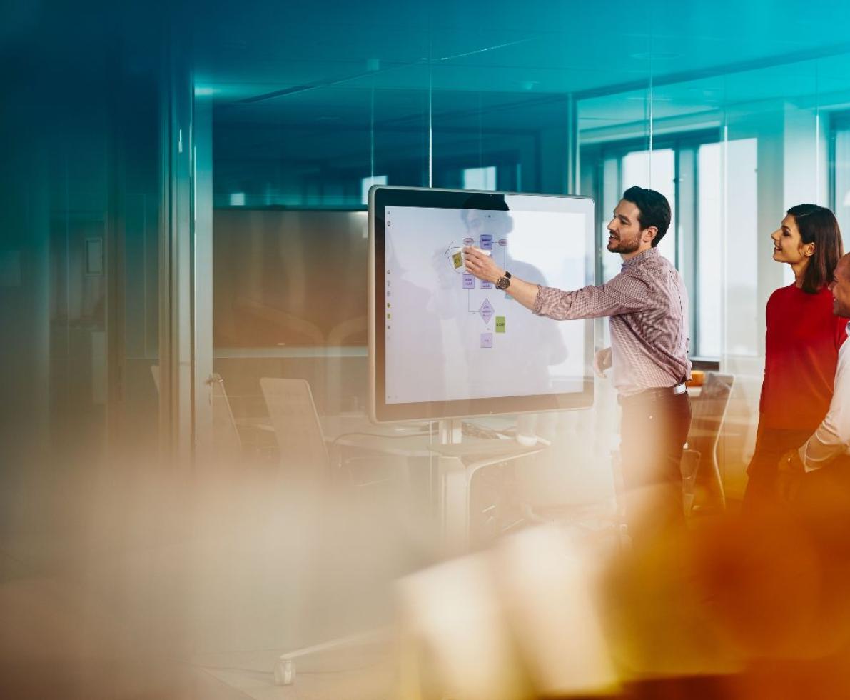 people working on a collaborative board