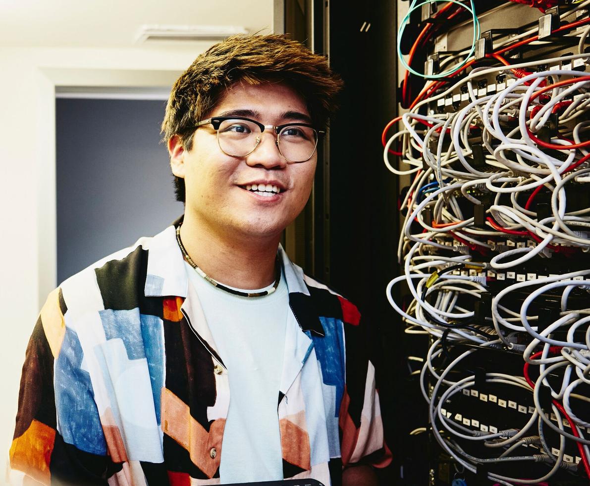 man standing in a servers room
